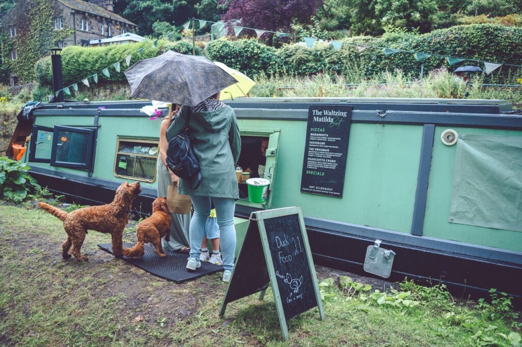 customers and their dogs visit the waltzing matilda boat in marple